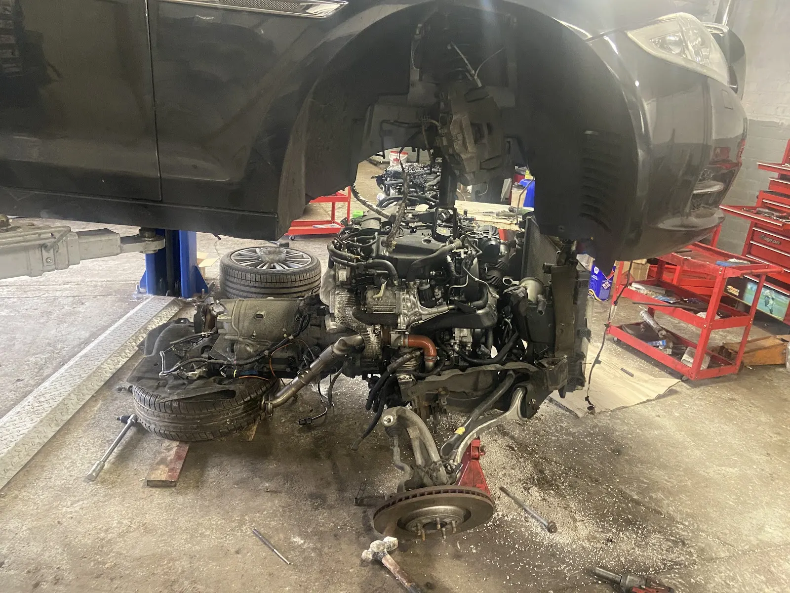Engine and suspension work on a lift