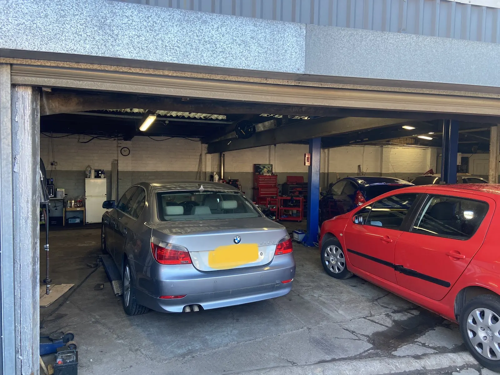 Cars in the workshop bays